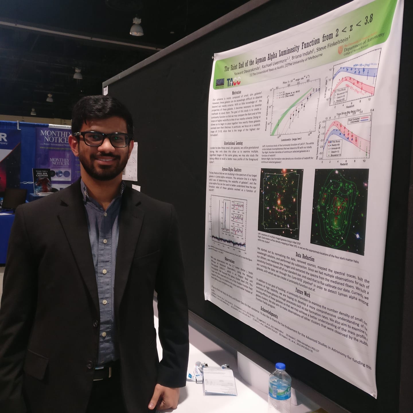 A picture of Yaswant standing in front of a research poster.